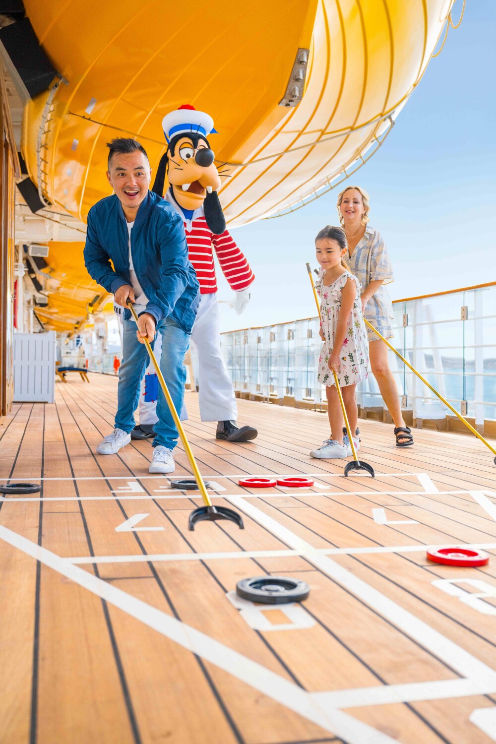 Family Playing Shuffle Board with Goofy resized