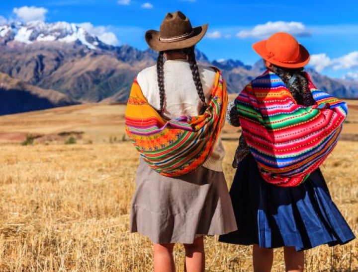 Peruvian women in national clothing crossing field The Sacred Valley 000028962466 Full